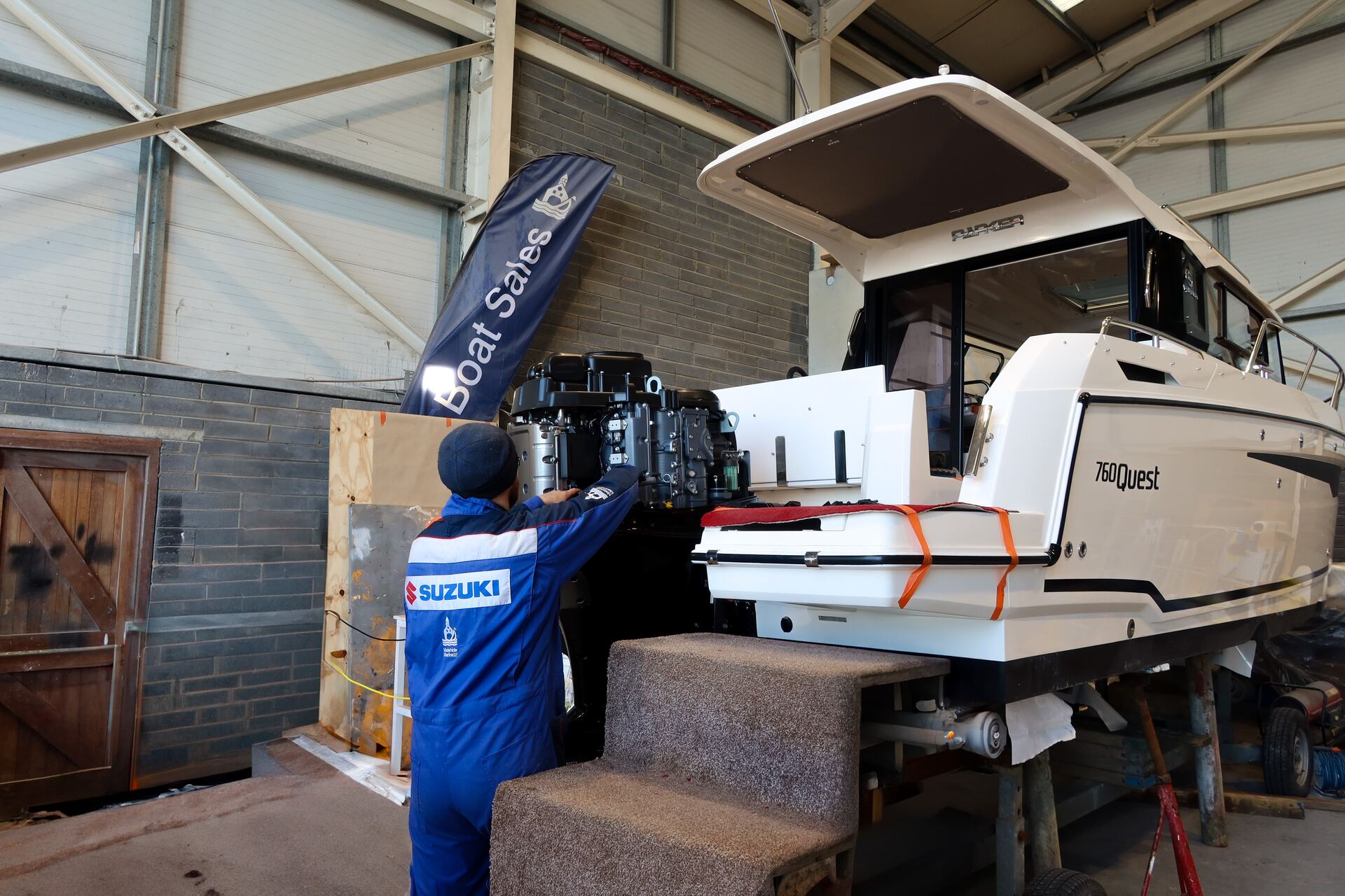 Engineer preparing boat engine for spring