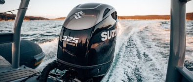Marine engineers installing a Suzuki outboard at Malahide Marina